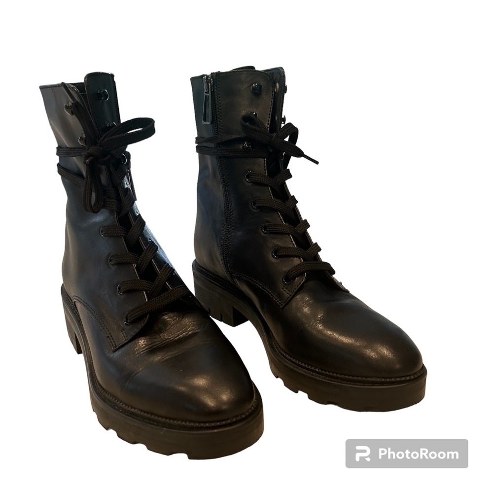 Dolce Vita black lace up combat boots.